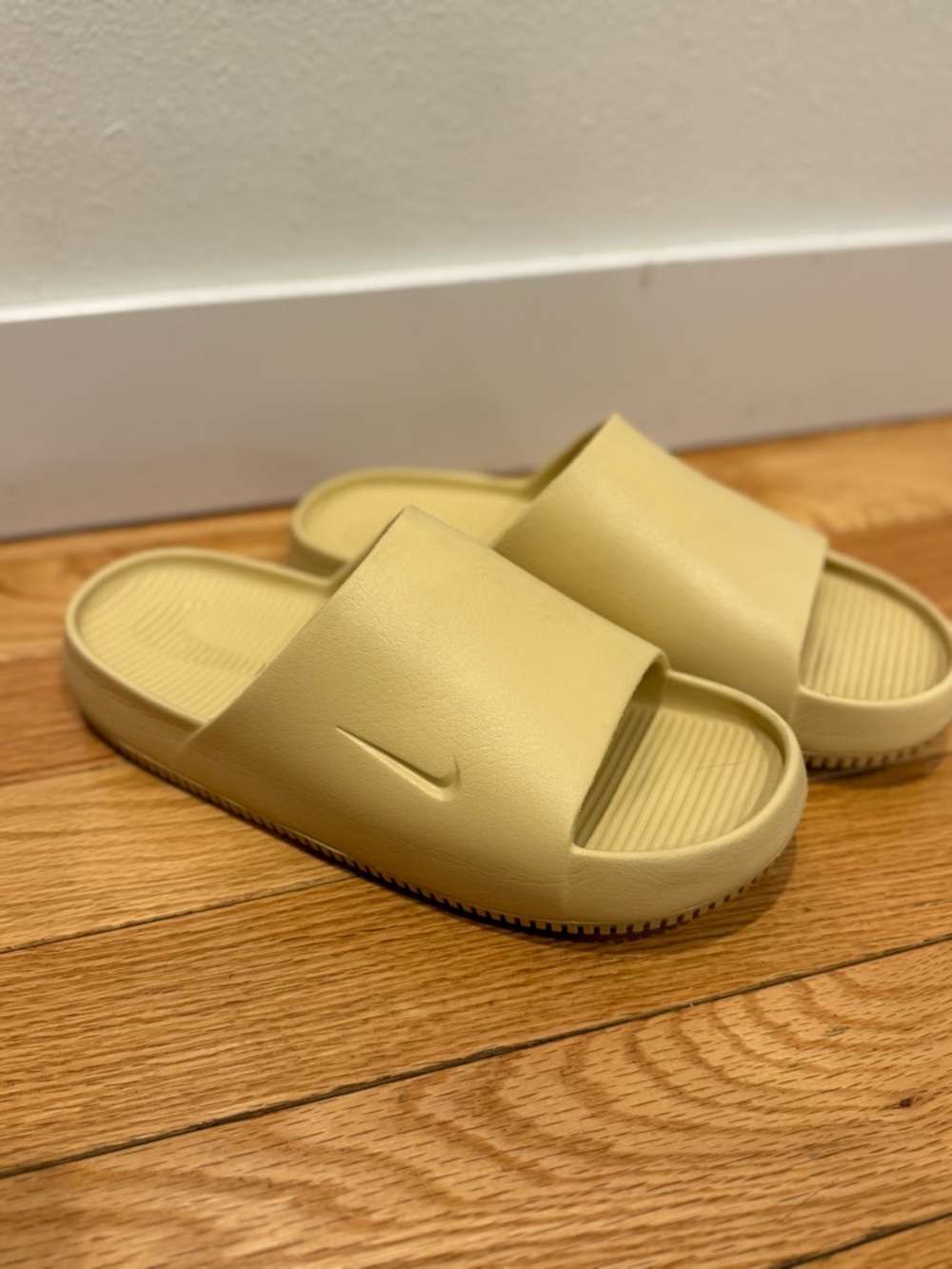 Nike “Calm” Slide Sandals in sesame color.